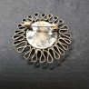 Ronde, vintage broche met bolle donkere steen